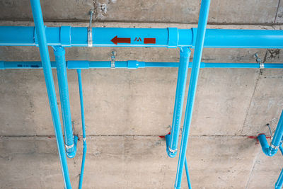 High angle view of chairs against wall