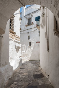 View of alley amidst buildings