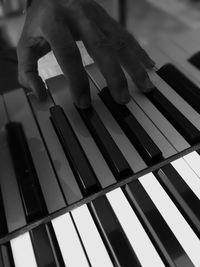 Shadow of person playing piano
