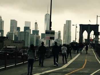 People walking on road in city