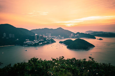 Scenic view of sea against orange sky