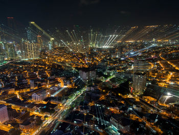 Aerial view of illuminated cityscape at night