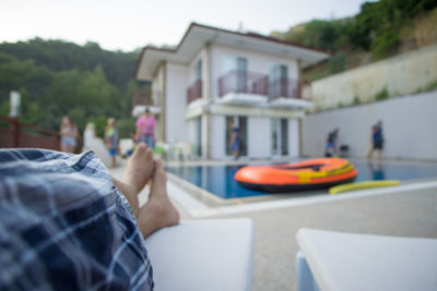 Low section of man wearing shoes