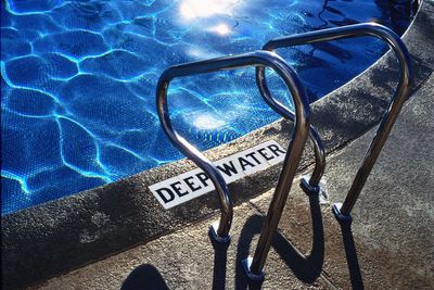 High angle view of bicycle sign by swimming pool