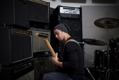 Young musician playing a guitar