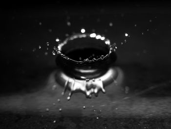 Close-up of water splashing on table