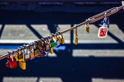 High angle view of padlocks on railing