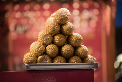 Close-up of stacked for sale on table