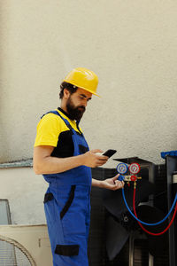 Rear view of man working at home