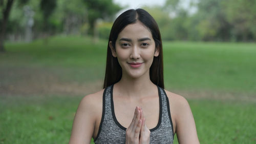 Portrait of smiling young woman outdoors