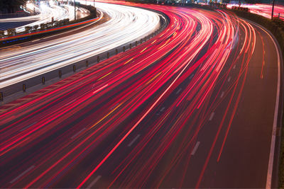 High angle view of light trails on road at night