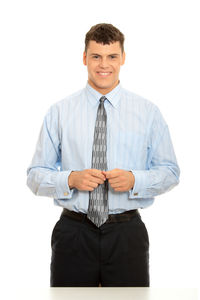 Mid adult man standing against white background