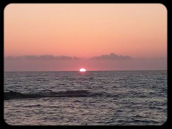 Scenic view of sea at sunset