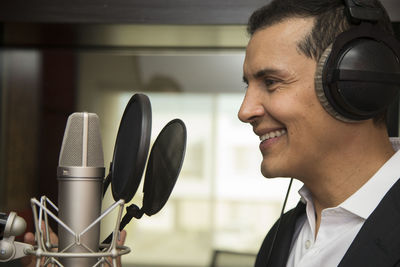 Portrait of smiling man using mobile phone
