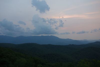 Scenic view of mountains against sky at sunset