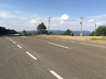 Empty road against sky