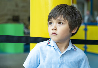 Portrait of cute boy looking away