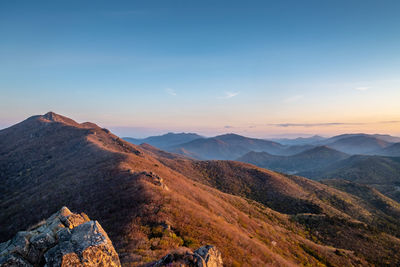 Scenic view of mountains against sky during sunset