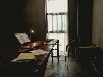 Xylophone with sheet music in room