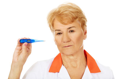 Close-up portrait of man against white background