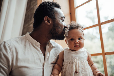 Father with baby at home