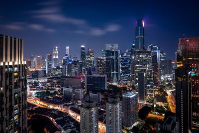 High angle view of illuminated city buildings at night