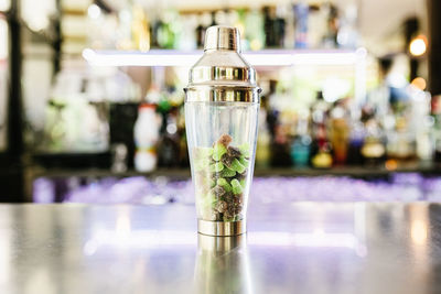 Close-up of glass bottle on table