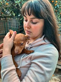 Portrait of woman with dog