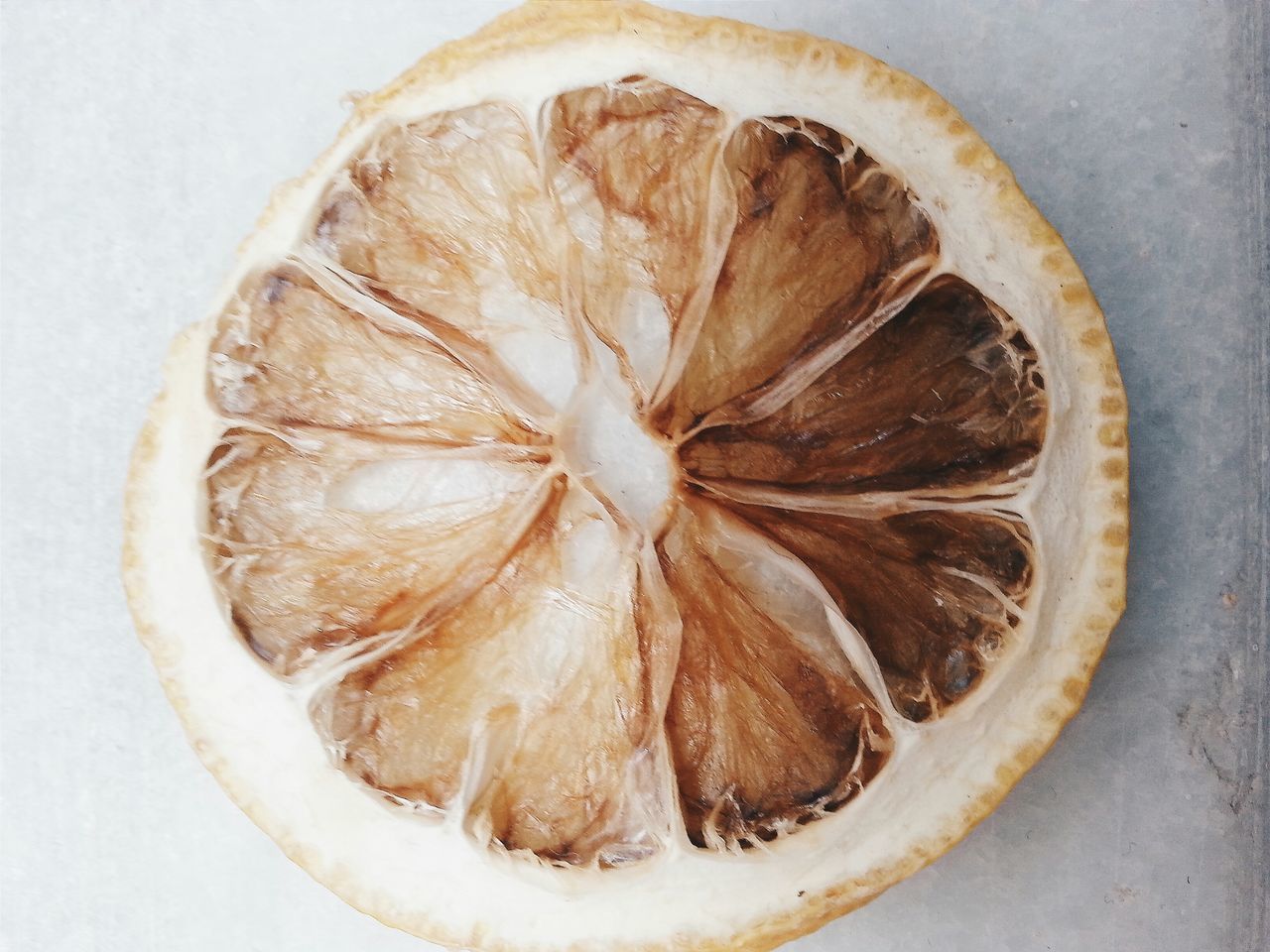 food and drink, food, freshness, still life, indoors, close-up, healthy eating, table, directly above, high angle view, plate, no people, circle, bowl, fruit, ready-to-eat, slice, cross section, brown, overhead view