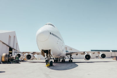 Airplane on airport against clear sky