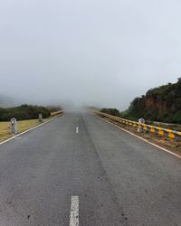 Empty road against clear sky