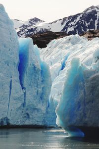 Scenic view of frozen lake against mountain