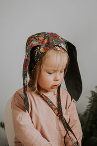 Toddler baby girl in funny hat with ears having fun