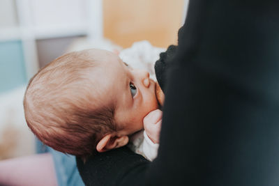 Close-up portrait of cute baby at home