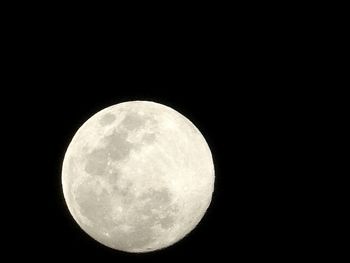 Low angle view of moon against sky at night