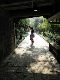 Full length of woman standing by railing