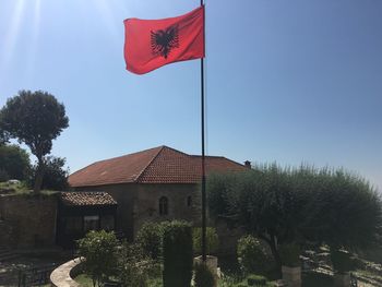 Low angle view of flag against sky