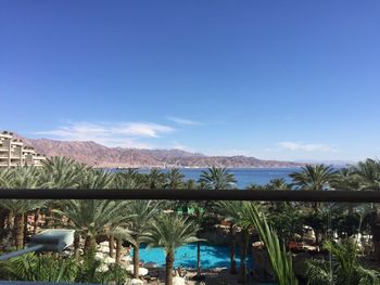 View of mountain range against blue sky