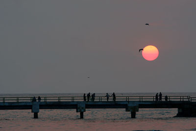 Scenic view of sea against clear sky during sunset