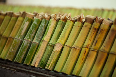 Close-up of chopped bamboos in row