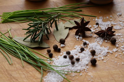 High angle view of herbs and spices on wooden table