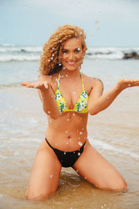 Young woman in bikini on beach