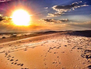 Scenic view of beach at sunset