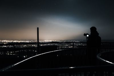 Silhouette of bridge at night
