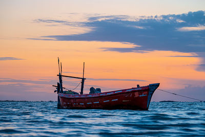 Sunset view with cloudy sky at gadani beach with dhow boat