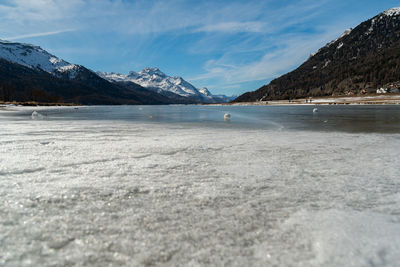 Switzerland, february 21, 2023 panorama with the lake of silvaplana and the mount corvatsch 