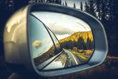 Reflection of sky on side-view mirror