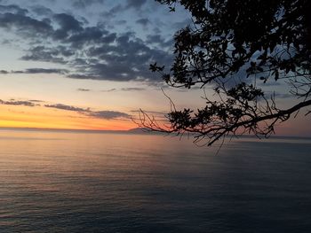 Scenic view of sea against sky at sunset