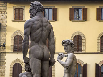 Statue in front of building