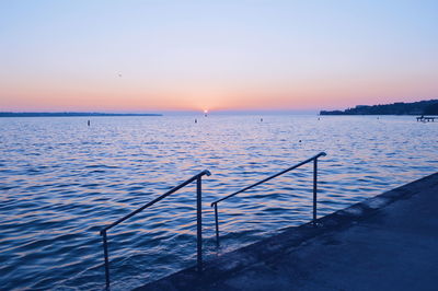 Scenic view of calm sea at sunset